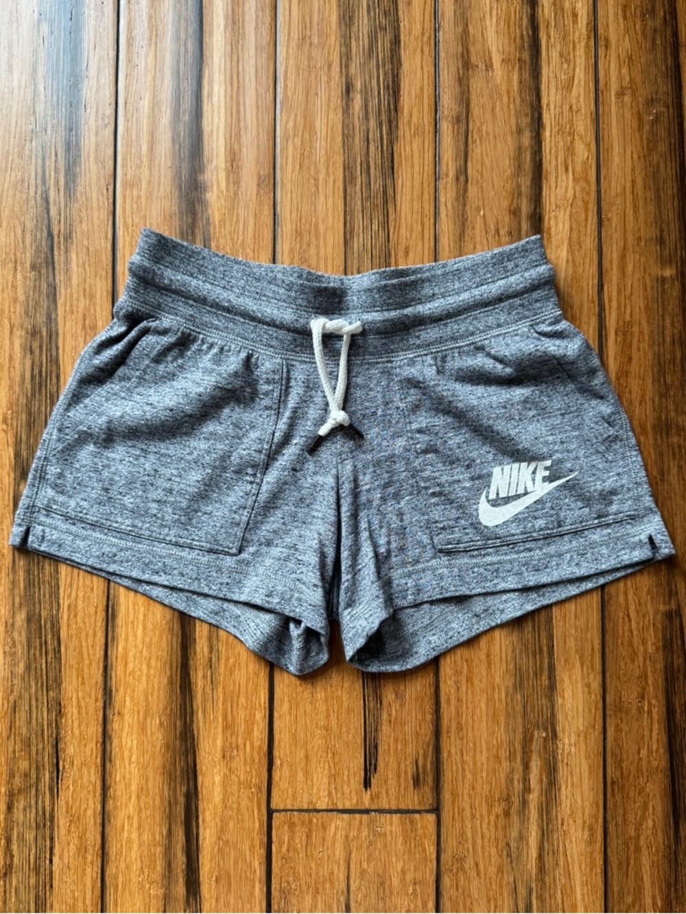 Nike Women's Heather Gray Athletic Shorts with White Logo